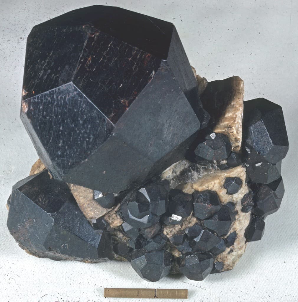 Garnet — almandine crystals showing the dodecahedral form, on matrix